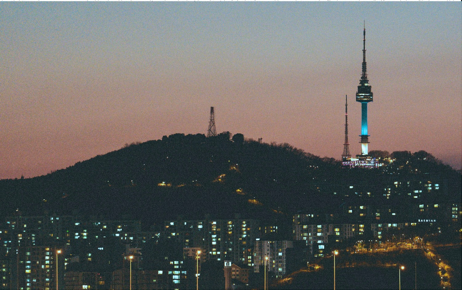 The Seoul skyline at dusk, N Seoul Tower lit on the right.